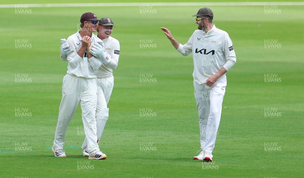 190626 - Glamorgan v Surrey, Rothesay County Championship Division 1- Adam Thomas of Surrey celebrates after he catches Sean Dickson of Glamorgan of the bowling of Jordan Clark of Surrey