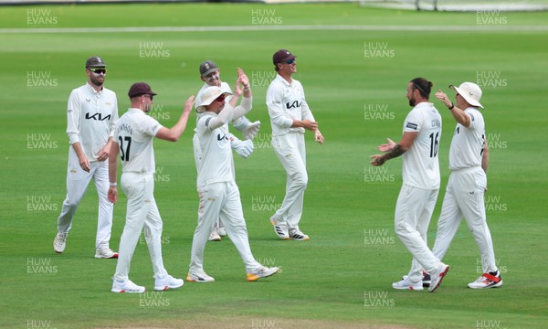 190626 - Glamorgan v Surrey, Rothesay County Championship Division 1- Adam Thomas of Surrey celebrates after he catches Sean Dickson of Glamorgan of the bowling of Jordan Clark of Surrey