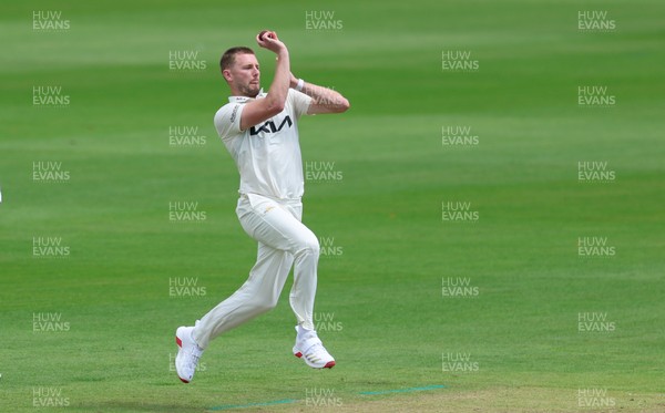 190626 - Glamorgan v Surrey, Rothesay County Championship Division 1- Gus Atkinson of Surrey bowls