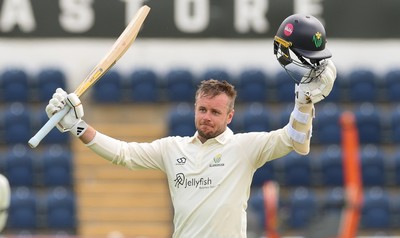 200626 - Glamorgan v Surrey, Rothesay County Championship Division 1- Mason Crane of Glamorgan celebrates as he reaches his 100