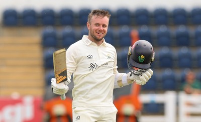 200626 - Glamorgan v Surrey, Rothesay County Championship Division 1- Mason Crane of Glamorgan celebrates as he reaches his 100