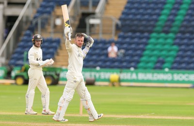 200626 - Glamorgan v Surrey, Rothesay County Championship Division 1- Mason Crane of Glamorgan celebrates as he reaches his 100