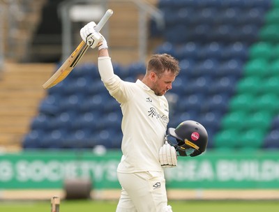 200626 - Glamorgan v Surrey, Rothesay County Championship Division 1- Mason Crane of Glamorgan celebrates as he reaches his 100