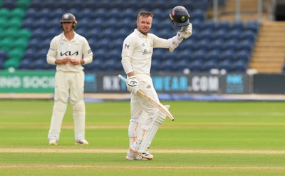 200626 - Glamorgan v Surrey, Rothesay County Championship Division 1- Mason Crane of Glamorgan celebrates as he reaches his 100