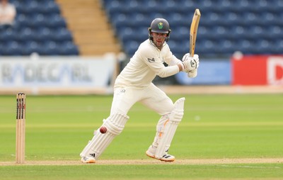 200626 - Glamorgan v Surrey, Rothesay County Championship Division 1- Mason Crane of Glamorgan plays a shot