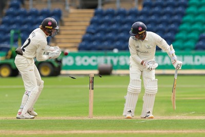 200626 - Glamorgan v Surrey, Rothesay County Championship Division 1- Mason Crane of Glamorgan is bowled by Dan Lawrence of Surrey for 106