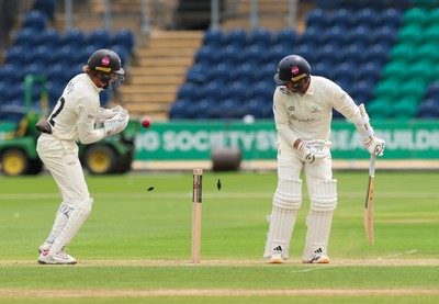 200626 - Glamorgan v Surrey, Rothesay County Championship Division 1- Mason Crane of Glamorgan is bowled by Dan Lawrence of Surrey for 106
