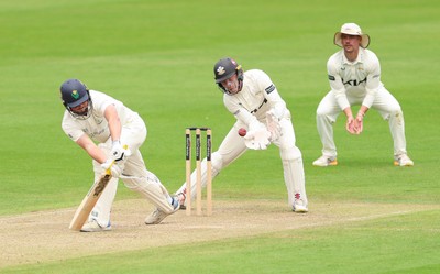 200626 - Glamorgan v Surrey, Rothesay County Championship Division 1- Ollie Pope of Surrey takes the ball as Tom Norton  of Glamorgan fails to connect