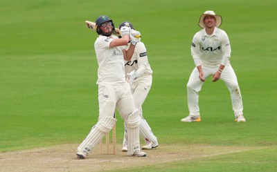 200626 - Glamorgan v Surrey, Rothesay County Championship Division 1- Tom Norton  of Glamorgan hits a four