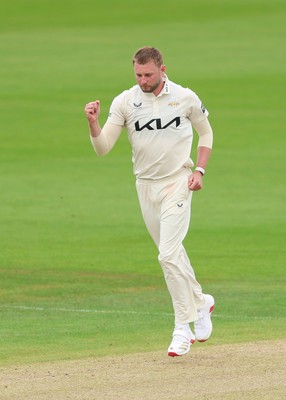 200626 - Glamorgan v Surrey, Rothesay County Championship Division 1- Gus Atkinson of Surrey celebrates after bowling Colin Ingram of Glamorgan