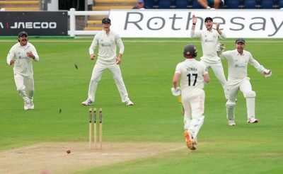 200626 - Glamorgan v Surrey, Rothesay County Championship Division 1- Glamorgan celebrate as Rory Burns of Surrey is run out by Ben Kellaway of Glamorgan