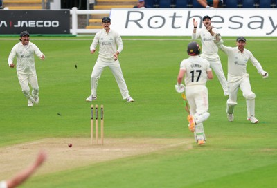 200626 - Glamorgan v Surrey, Rothesay County Championship Division 1- Glamorgan celebrate as Rory Burns of Surrey is run out by Ben Kellaway of Glamorgan