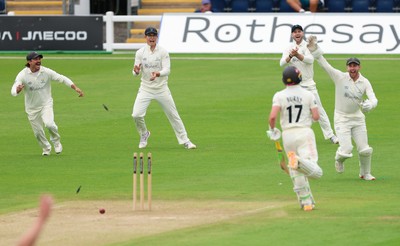 200626 - Glamorgan v Surrey, Rothesay County Championship Division 1- Glamorgan celebrate as Rory Burns of Surrey is run out by Ben Kellaway of Glamorgan