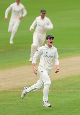 200626 - Glamorgan v Surrey, Rothesay County Championship Division 1- Ben Kellaway of Glamorgan celebrates after he runs out Rory Burns of Surrey