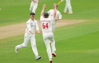 200626 - Glamorgan v Surrey, Rothesay County Championship Division 1- Ben Kellaway of Glamorgan celebrates with Timm van der Gugten of Glamorgan after he runs out Rory Burns of Surrey