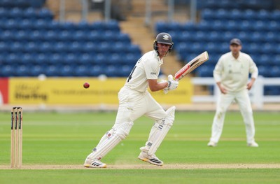 200626 - Glamorgan v Surrey, Rothesay County Championship Division 1- Adam Thomas of Surrey plays a shot