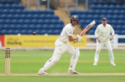 200626 - Glamorgan v Surrey, Rothesay County Championship Division 1- Adam Thomas of Surrey plays a shot