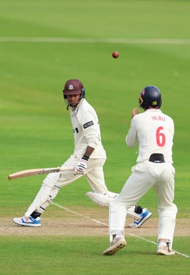 200626 - Glamorgan v Surrey, Rothesay County Championship Division 1- Henry Hurle of Glamorgan catches Rahul Chahar of Surrey
