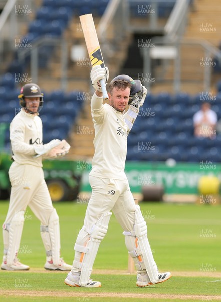 200626 - Glamorgan v Surrey, Rothesay County Championship Division 1- Mason Crane of Glamorgan celebrates as he reaches his 100