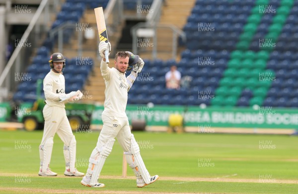 200626 - Glamorgan v Surrey, Rothesay County Championship Division 1- Mason Crane of Glamorgan celebrates as he reaches his 100
