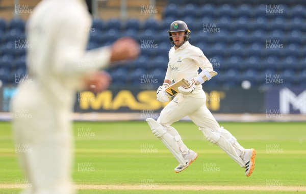 200626 - Glamorgan v Surrey, Rothesay County Championship Division 1- Mason Crane of Glamorgan adds the runs