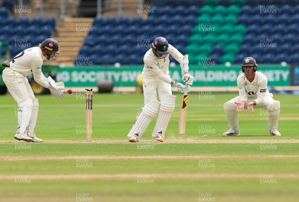 200626 - Glamorgan v Surrey, Rothesay County Championship Division 1- Mason Crane of Glamorgan is bowled by Dan Lawrence of Surrey for 106