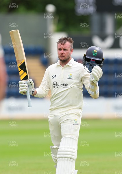 200626 - Glamorgan v Surrey, Rothesay County Championship Division 1- Mason Crane of Glamorgan acknowledges his team mates at the supporters as he leaves the field after he is bowled by Dan Lawrence of Surrey for 106