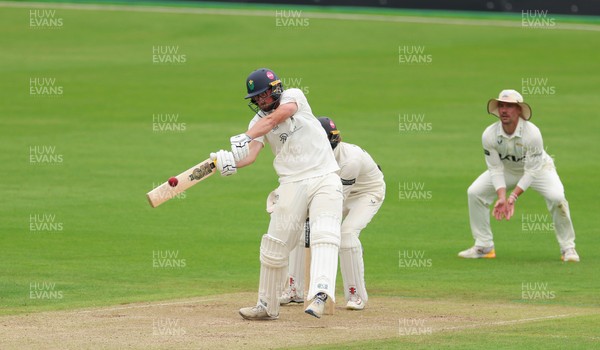 200626 - Glamorgan v Surrey, Rothesay County Championship Division 1- Tom Norton  of Glamorgan hits a four