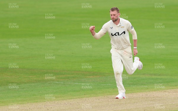 200626 - Glamorgan v Surrey, Rothesay County Championship Division 1- Gus Atkinson of Surrey celebrates after bowling Colin Ingram of Glamorgan