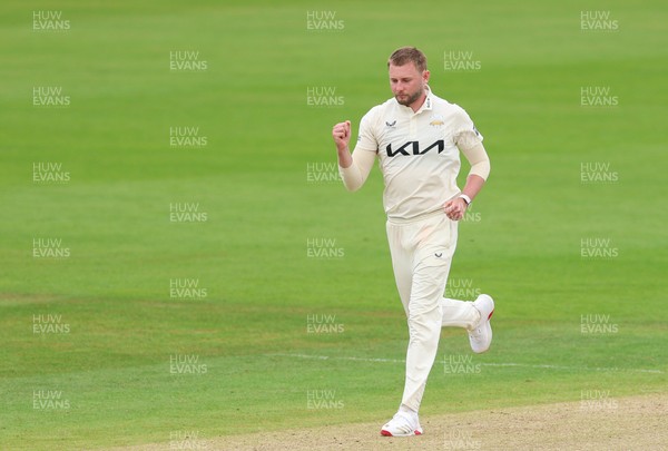 200626 - Glamorgan v Surrey, Rothesay County Championship Division 1- Gus Atkinson of Surrey celebrates after bowling Colin Ingram of Glamorgan
