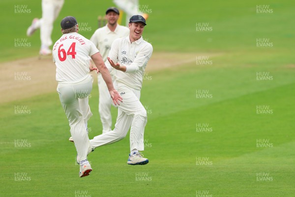 200626 - Glamorgan v Surrey, Rothesay County Championship Division 1- Ben Kellaway of Glamorgan celebrates with Timm van der Gugten of Glamorgan after he runs out Rory Burns of Surrey