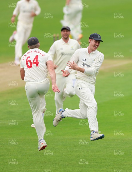 200626 - Glamorgan v Surrey, Rothesay County Championship Division 1- Ben Kellaway of Glamorgan celebrates with Timm van der Gugten of Glamorgan after he runs out Rory Burns of Surrey