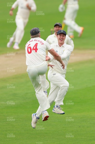 200626 - Glamorgan v Surrey, Rothesay County Championship Division 1- Ben Kellaway of Glamorgan celebrates with Timm van der Gugten of Glamorgan after he runs out Rory Burns of Surrey