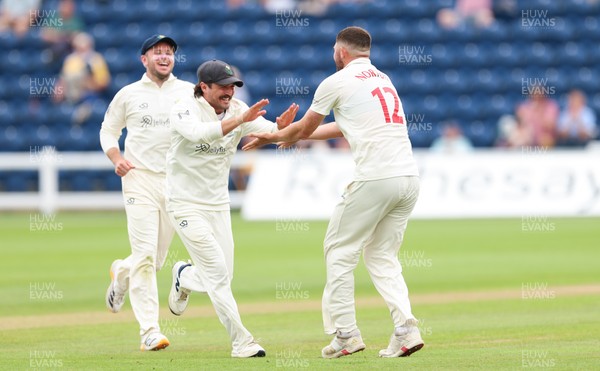 200626 - Glamorgan v Surrey, Rothesay County Championship Division 1- Tom Norton  of Glamorgan celebrates with Kiran Carlson of Glamorgan after taking the wicket of Dom Sibley of Surrey