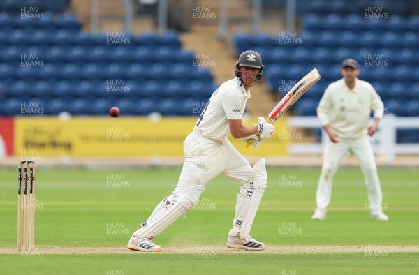 200626 - Glamorgan v Surrey, Rothesay County Championship Division 1- Adam Thomas of Surrey plays a shot