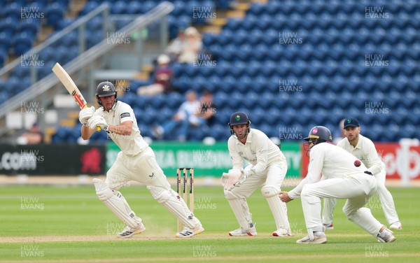 200626 - Glamorgan v Surrey, Rothesay County Championship Division 1- Adam Thomas of Surrey plays a shot
