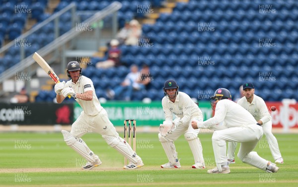 200626 - Glamorgan v Surrey, Rothesay County Championship Division 1- Adam Thomas of Surrey plays a shot