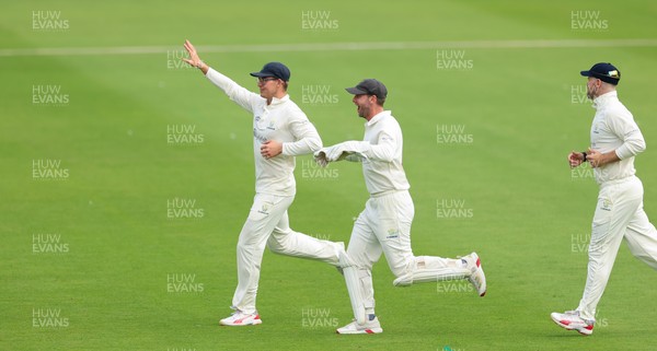 200626 - Glamorgan v Surrey, Rothesay County Championship Division 1- Asa Tribe of Glamorgan celebrates with Chris Cooke of Glamorgan as he catches Gus Atkinson of Surrey