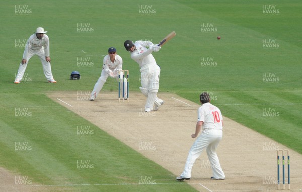 21.04.11 - Glamorgan v Surrey - LV County Championship Division 2 - Zander de Bruyn of Surrey hits a shot off the bowling of Robert Croft of Glamorgan which is caught out by Graham Wagg. 