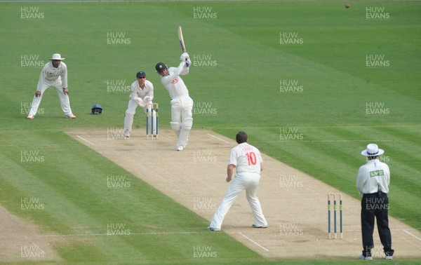 21.04.11 - Glamorgan v Surrey - LV County Championship Division 2 - Zander de Bruyn of Surrey hits a shot off the bowling of Robert Croft of Glamorgan which is caught out by Graham Wagg. 