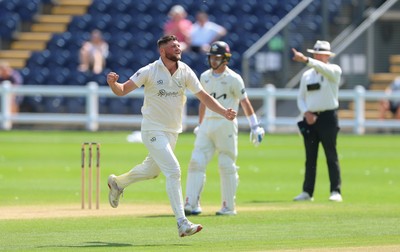 210626 - Glamorgan v Surrey, Rothesay County Championship Division 1- Tom Norton  of Glamorgan celebrates as he takes the wicket of Rory Burns of Surrey