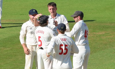 210626 - Glamorgan v Surrey, Rothesay County Championship Division 1- Ryan Hadley of Glamorgan celebrates after taking the wicket of Ryan Patel of Surrey