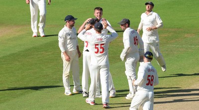 210626 - Glamorgan v Surrey, Rothesay County Championship Division 1- Ryan Hadley of Glamorgan celebrates after taking the wicket of Ryan Patel of Surrey