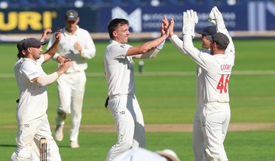210626 - Glamorgan v Surrey, Rothesay County Championship Division 1- Ryan Hadley of Glamorgan celebrates after taking the wicket of Adam Thomas of Surrey