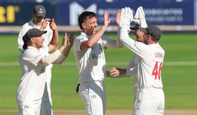 210626 - Glamorgan v Surrey, Rothesay County Championship Division 1- Ryan Hadley of Glamorgan celebrates after taking the wicket of Adam Thomas of Surrey