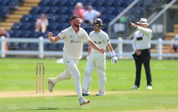 210626 - Glamorgan v Surrey, Rothesay County Championship Division 1- Tom Norton  of Glamorgan celebrates as he takes the wicket of Rory Burns of Surrey