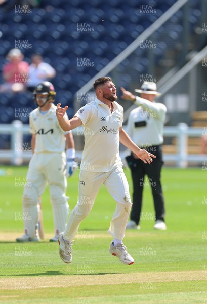 210626 - Glamorgan v Surrey, Rothesay County Championship Division 1- Tom Norton  of Glamorgan celebrates as he takes the wicket of Rory Burns of Surrey