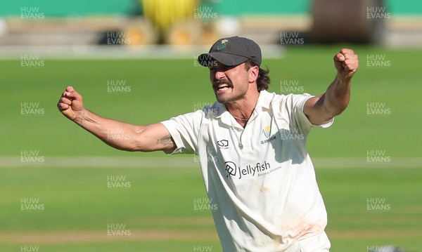 210626 - Glamorgan v Surrey, Rothesay County Championship Division 1- Kiran Carlson of Glamorgan celebrates as Glamorgan dismiss  Adam Thomas of Surrey