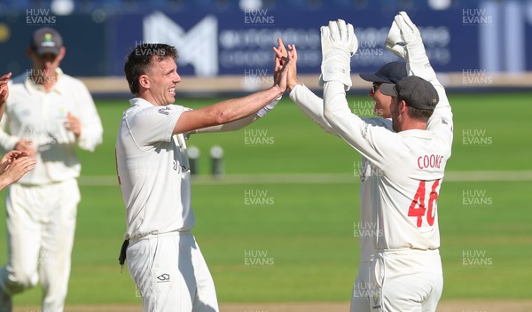 210626 - Glamorgan v Surrey, Rothesay County Championship Division 1- Ryan Hadley of Glamorgan celebrates after taking the wicket of Adam Thomas of Surrey