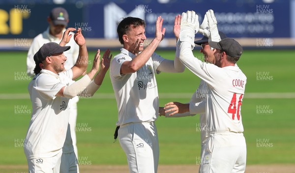 210626 - Glamorgan v Surrey, Rothesay County Championship Division 1- Ryan Hadley of Glamorgan celebrates after taking the wicket of Adam Thomas of Surrey